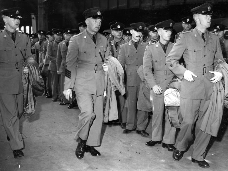 The Queen's Own Rifles of Canada and Canadian Black Watch arrive at Waverley Station ready to perform at the Edinburgh Military Tattoo 1962.