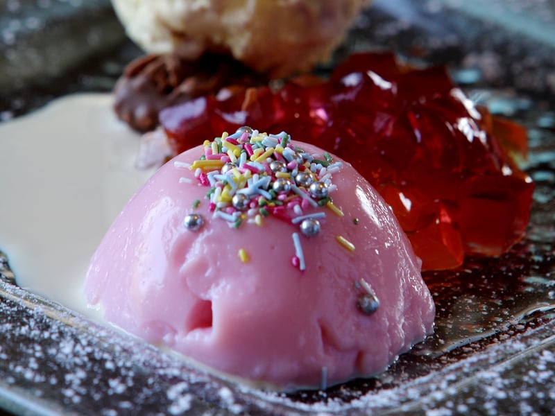 It never looked this fancy, but blancmange was a school dinner staple in the 60s and 70s. The dessert came in various flavours and colours but was always made with milk, cream and sugar, and had a slight wobble when done properly. Some children loved it, but others couldn't stand the texture, with the consistency sometimes compared to that of a rubber ball.