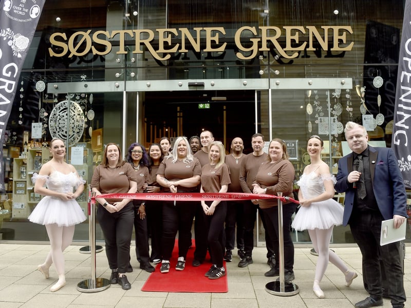 Donna Collins, store manager, with the team at the new store.