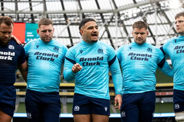 Captain Sione Tuipulotu, centre, addresses the Scotland team.