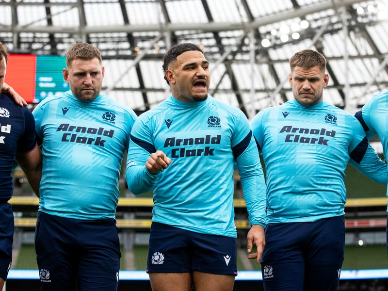 Captain Sione Tuipulotu, centre, addresses the Scotland team.