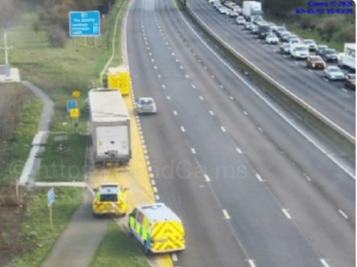 Motorway cameras show police vehicles on the M1 and standing traffic.