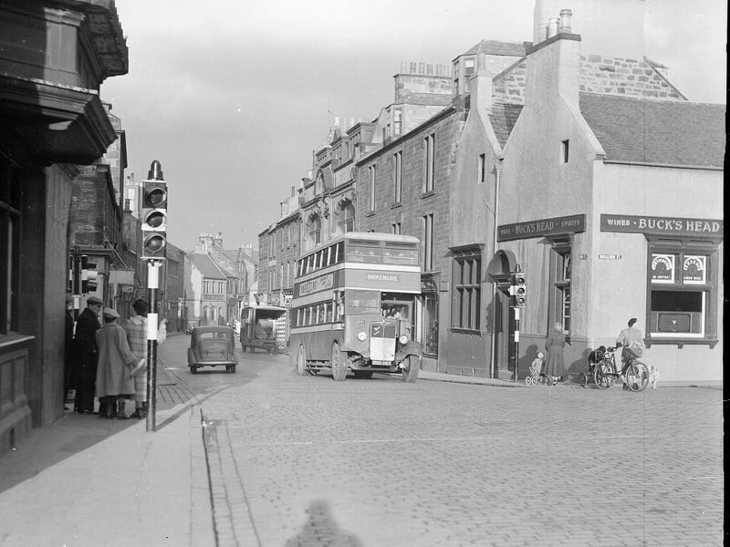 A bus stops at traffic lights at the High Street, Dalkeith, in February 1953. A new one way system was to be introduced to increase traffic flow.