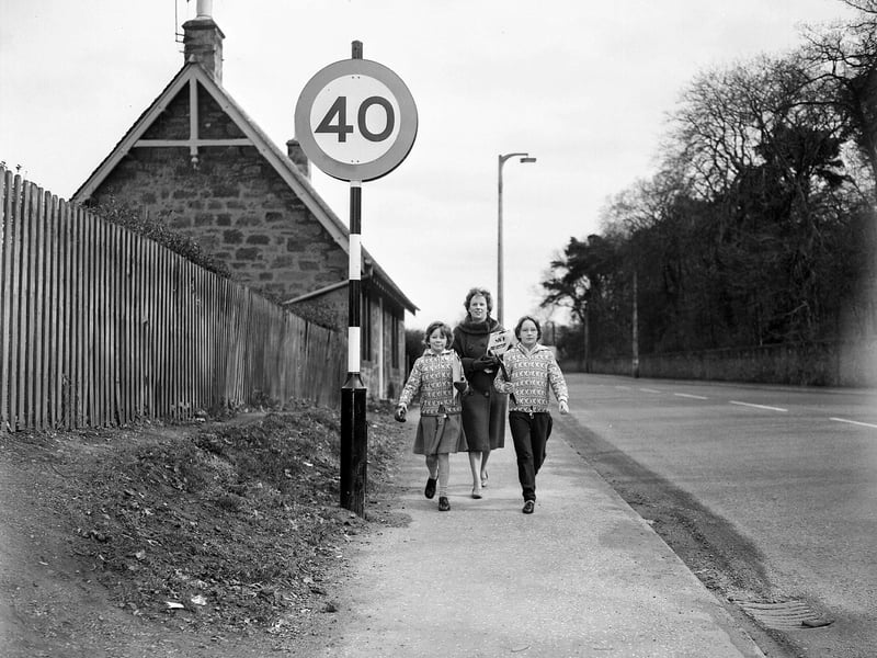 Mrs Reid and her two daughters Sally and Carol collecting signatures for petition protesting against 40mph speed limit on the Dalkeith to Lauder Road in May 1963.