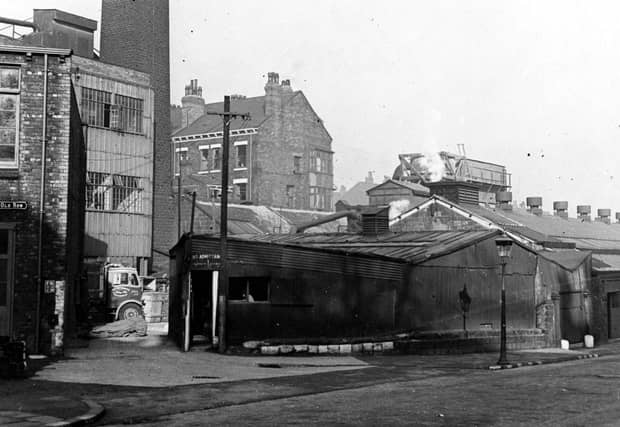 Asbestos factory of J. W. Roberts on Canal Road pictured in October 1943. Factory chimney in background. To the left can be seen the end of Old Row.