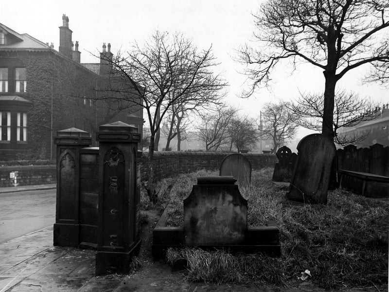 This photo from December 1947 shows part of the graveyard belonging to St Bartholomew's Church on the corner with Church Road and Strawberry Lane. The main entrance is visible in the foreground but the gate is no longer there