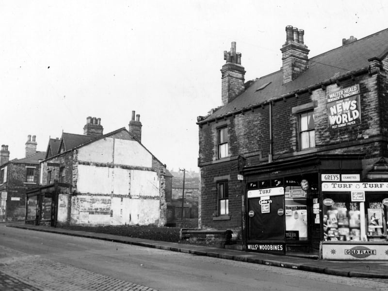 The junction Woodhouse Street and Pennington Street, newsagents shop, occupied by Walter and Gertrude Heald no 156. Nos.160-166 have been demolished. 168 Joseph Pickard, pawnbroker and jeweller. Note pawnbrokers sign. Junction Woodhouse Street and Pennington Court, no. 170, Frank Beaumont, boot repairer. Pictured in November 1952.