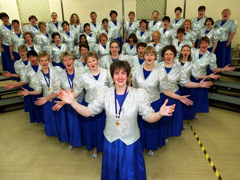 Female barber shop singers The White Rosettes were celebrating in November 1999 after winning a silver medal in the National Championships. Pictured, centre, is musical director Sally McLean.