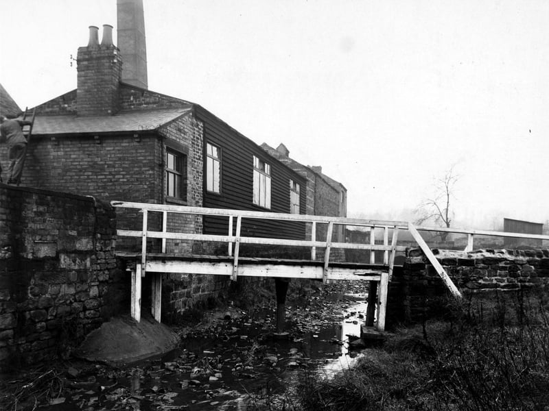 The footbridge over Meanwood Beck near the Dye Works on Wood Lane pictured in December 1948.