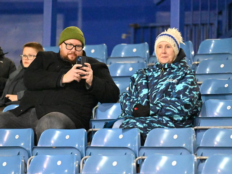 Brilliant photos of Pompey fans under the lights at Fratton Park against Derby County on Monday.