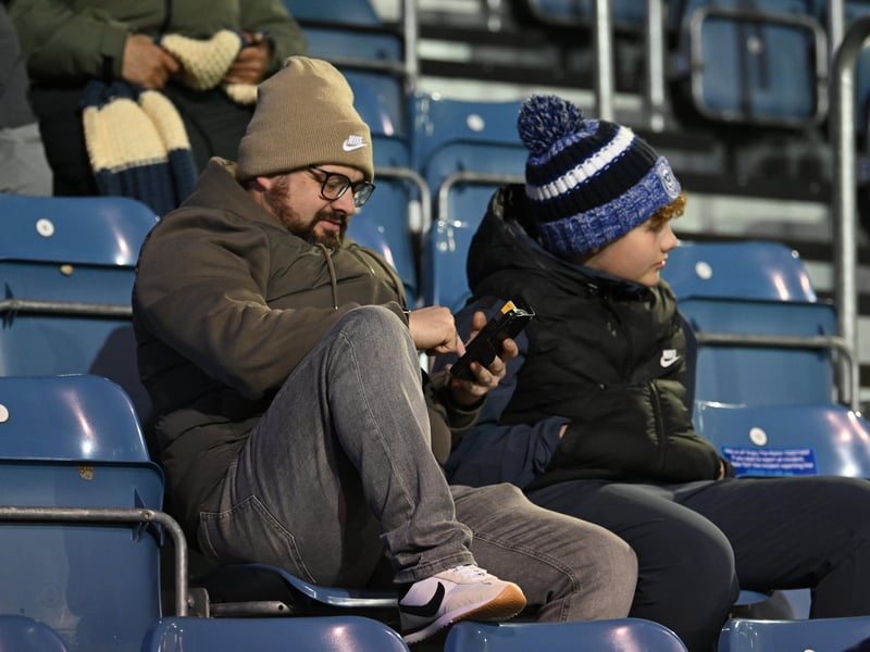 Brilliant photos of Pompey fans under the lights at Fratton Park against Derby County on Monday.