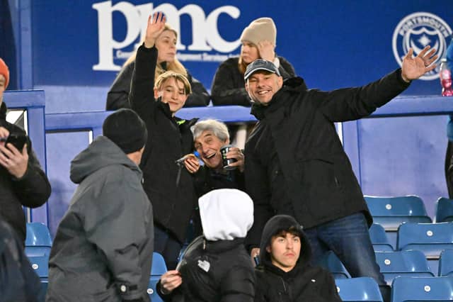 Brilliant photos of Pompey fans under the lights at Fratton Park against Derby County on Monday.