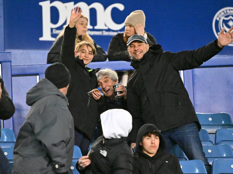Brilliant photos of Pompey fans under the lights at Fratton Park against Derby County on Monday.