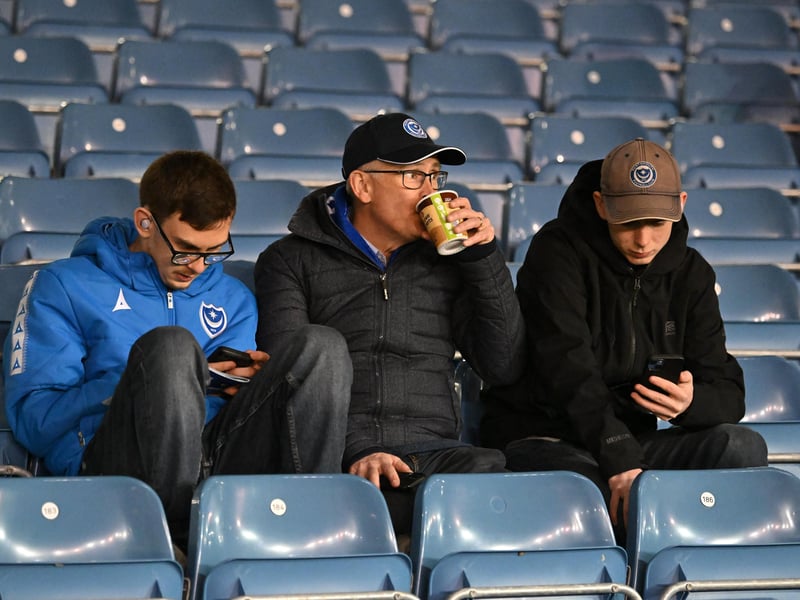 Brilliant photos of Pompey fans under the lights at Fratton Park against Derby County on Monday.