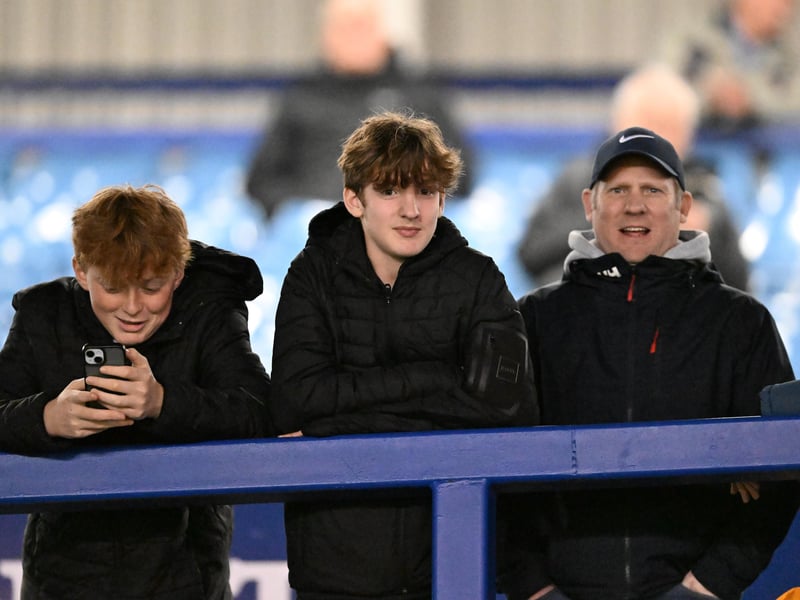 Brilliant photos of Pompey fans under the lights at Fratton Park against Derby County on Monday.