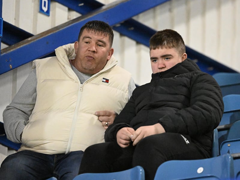 Brilliant photos of Pompey fans under the lights at Fratton Park against Derby County on Monday.