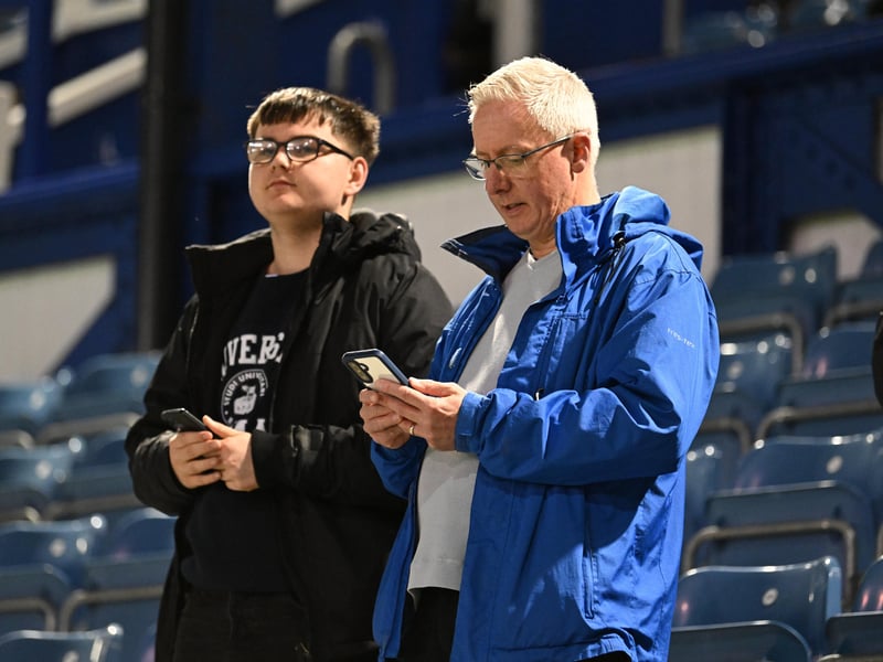 Brilliant photos of Pompey fans under the lights at Fratton Park against Derby County on Monday.