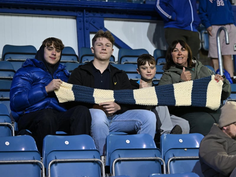Brilliant photos of Pompey fans under the lights at Fratton Park against Derby County on Monday.