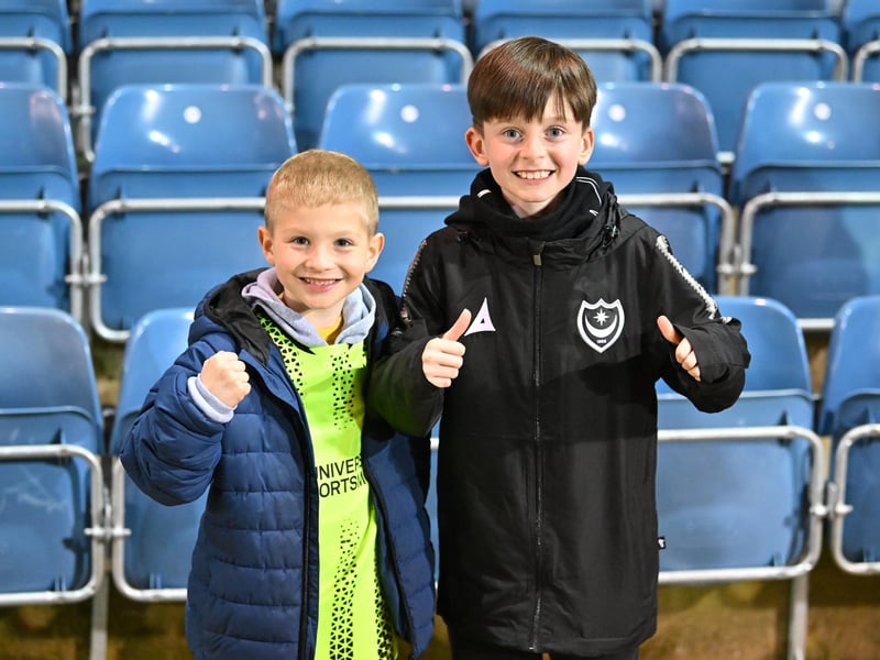 Brilliant photos of Pompey fans under the lights at Fratton Park against Derby County on Monday.