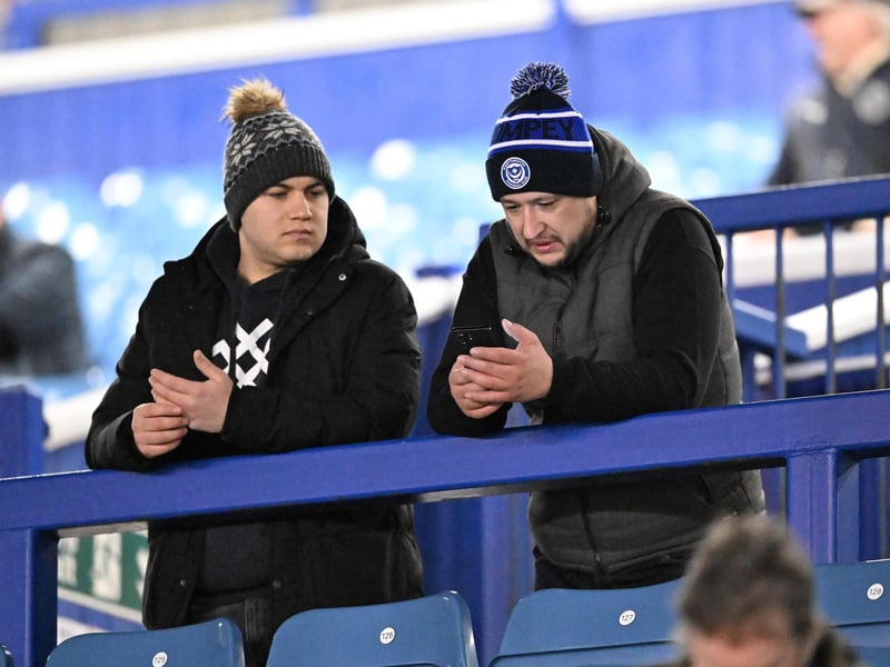 Brilliant photos of Pompey fans under the lights at Fratton Park against Derby County on Monday.