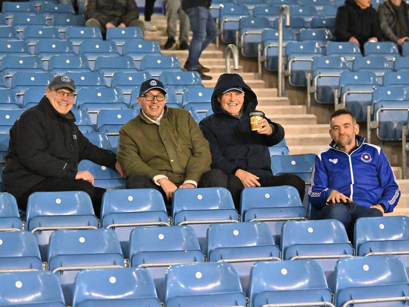 Brilliant photos of Pompey fans under the lights at Fratton Park against Derby County on Monday.