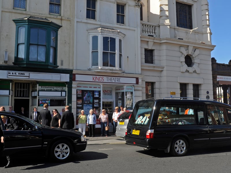 Ray King's funeral stops outside his sweet shop next to The Kings Theatre in 2016.