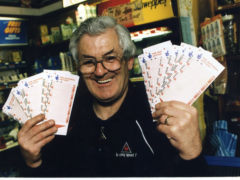 Bathgate newsagent William Boyd holds a bunch of National Lottery tickets in 1996, after describing how the lottery had boosted his profits