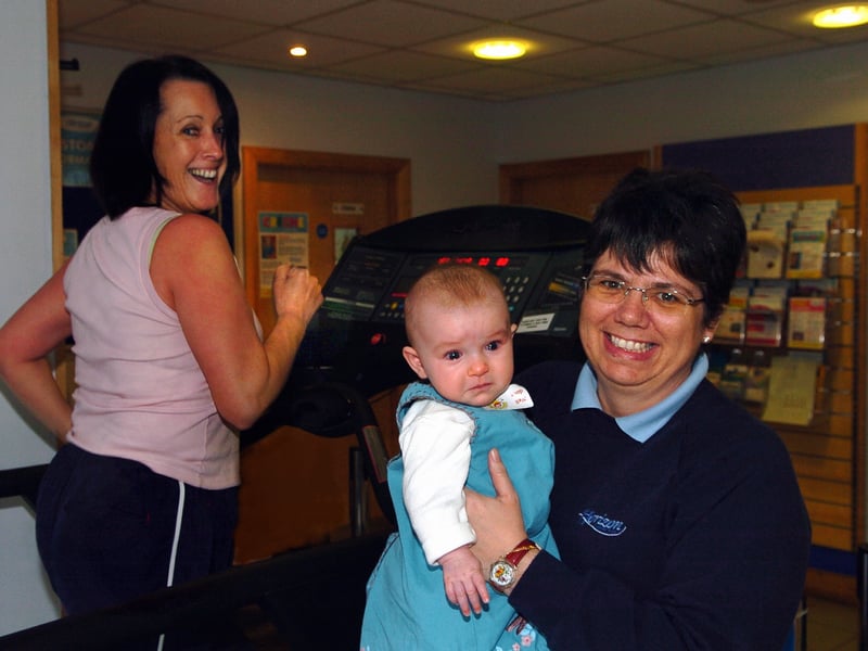 Creche assistant Susan Curtis finishes 15 minutes on the treadmill at Havant Leisure Centre in 2007 while creche leader Beverley Underwood gets baby Freya Thynne involved 