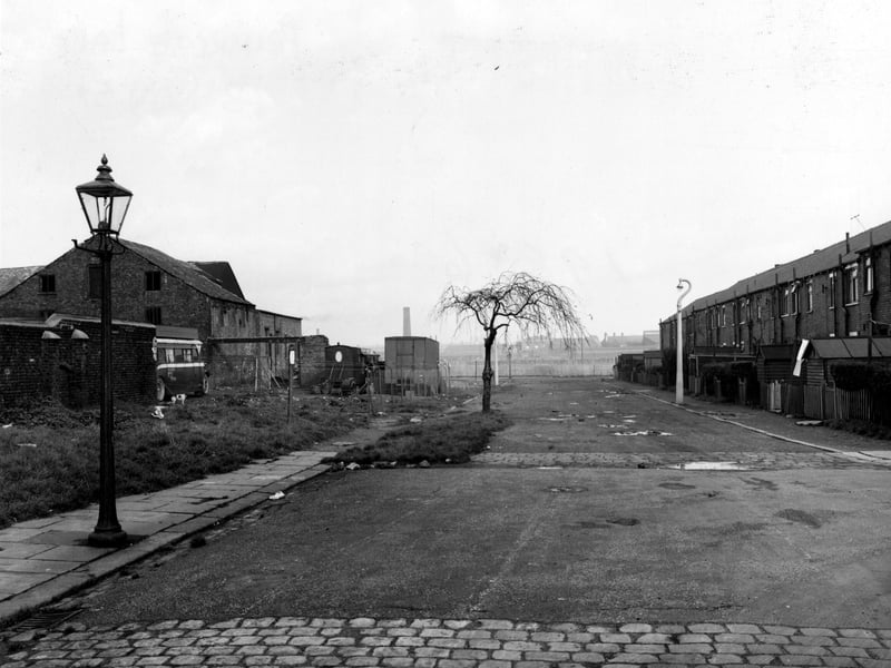 Looking North-East along Primrose Lane towards Burton Avenue in November 1954. Burton Row is visible in the background.