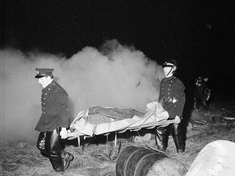 Firemen carry a stretcher during a mock air crash at Turnhouse in December 1963.