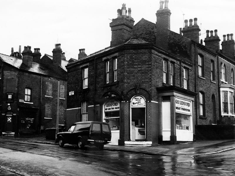 A butchers at number 45 Hyde Park Road (right) on the corner with Alexandra Road, left, in December 1972. Run by George Ledsford, a quality meat purveyor selling beef, lamb, pork and poultry, Mr Ledsford has the motto 'Walk in please, walk out pleased!' written above the door.