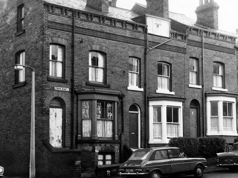 V in December 1972. The photo shows three through terraced houses with bay windows on the ground and celler levels. Each house also has a small private front yard. On the far left is Queen's Road.
