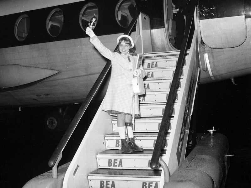 12-year-old polio patient Jennifer Noble off to Malta for holiday waving at Turnhouse airport in November 1962.