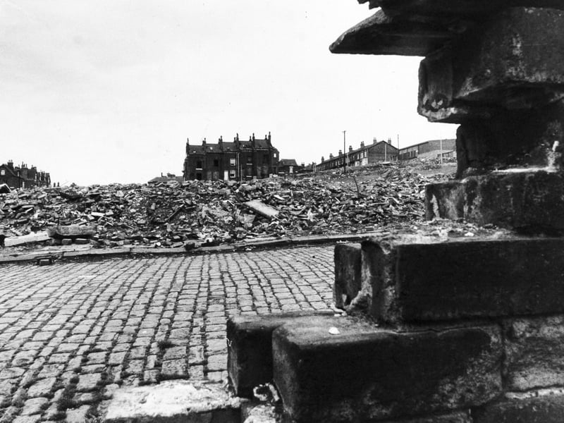 The house standing in the middle of the clearance area in May 1976 was the home of Emilia McCourt, the only resident left on Howden Place.