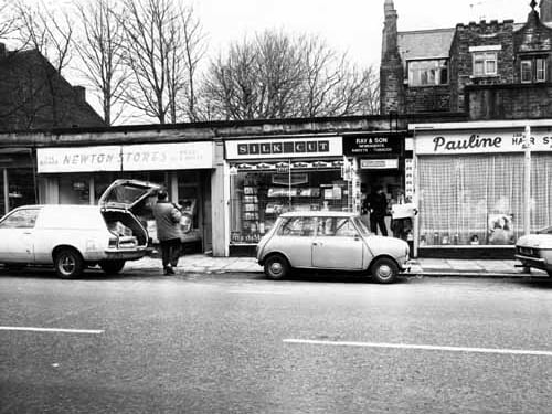 Part of Newton Parade, a row of shops on Chapeltown Road opposite the junction with St. Mary's Road. On the left is Newton Stores, proprietors A & S Wolfe, at no. 8 Newton Parade; in the centre is Ray & Son, newsagents, at no.7, and on the right Pauline, Ladies Hair Stylist at no. 6. Pictured in March 1981.