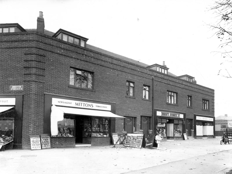 Businesses on Oakwood Lane with Fredrick Mitton, Newsagent on the left at number 372 Oakwood Lane. Next door at 370 is Thrift Stores Ltd. Millicent Bland, draper, is visible at 368. Amberton Approach can be seen far right. Pictured in October 1937.