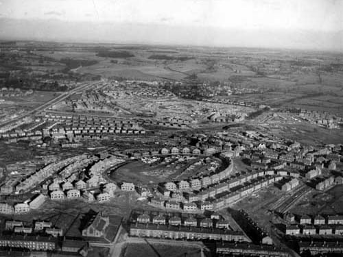 A bird's eye view from February 1937 looking east of housing development on the Gipton estate. Houses in varying stages of development can be seen on St. Wilfrid's Crescent in the foreground and the Amberton's in the background.
