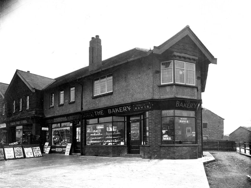 'The Bakery' Prop: Miss Florence Gadsby at number 1 Hollin Park Parade with W & E Drennan, newsagents on the left at number 2 and Parade fruit stores at number 3. Pictured in January 1936.