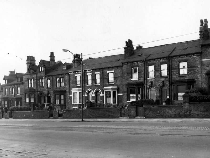 The north west side of Roundhay Road in November 1954. Silver Star Libraries and a physiotherapy clinic are shown.