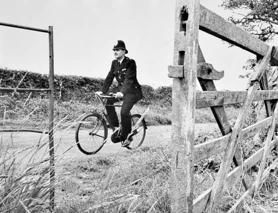 Police Constable Roy Duncalfe on patrol on his bicycle, September 14, 1965. He joined the police in 1946 and served in Market Drayton and Hodnet. In about 1968 he moved to North Road, Wellington, and was based at Wellington police station. He was said to be Shropshire's first dog handler and his dog Sultan was well known. PC Duncalfe retired in March 1974.