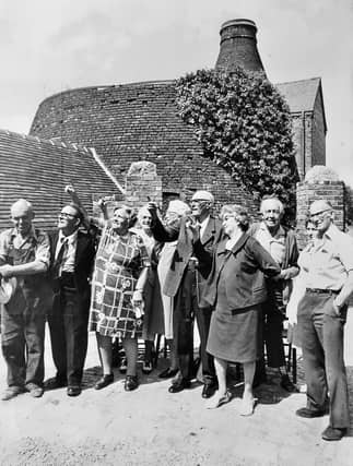 Former employees visit Coalport China Works on July 17, 1976. The original caption reads: 'Time to remember for ex-employees at the old Coalport Potteries, Telford. A gathering of retired workers met at the potteries on Saturday and are seen looking at the renovated workings during their visit.'