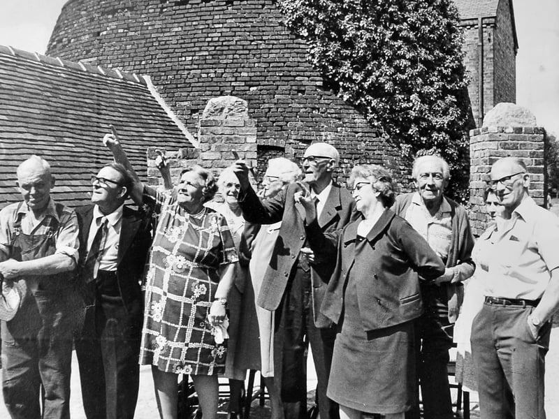Former employees visit Coalport China Works on July 17, 1976. The original caption reads: 'Time to remember for ex-employees at the old Coalport Potteries, Telford. A gathering of retired workers met at the potteries on Saturday and are seen looking at the renovated workings during their visit.'