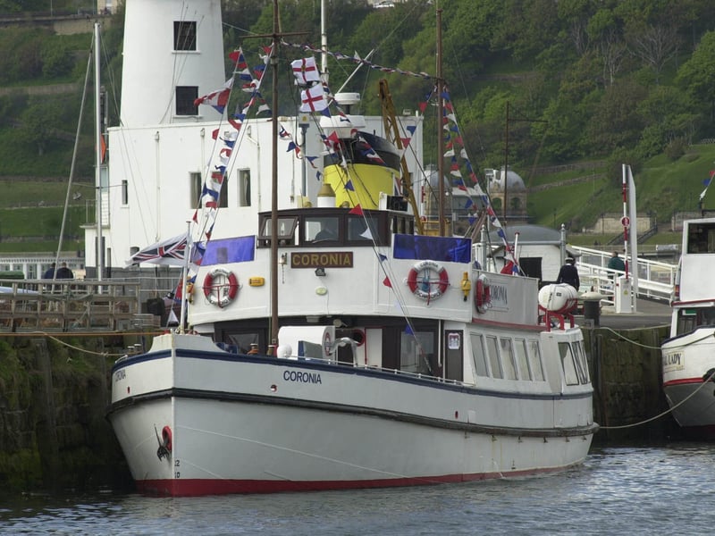 The pleasure cruiser MV Coronia moored in Scarborough in May 2000.  It's regular trips from Scarborough to whitby had been stopped as they were two miles longer than the allowed journey distance.