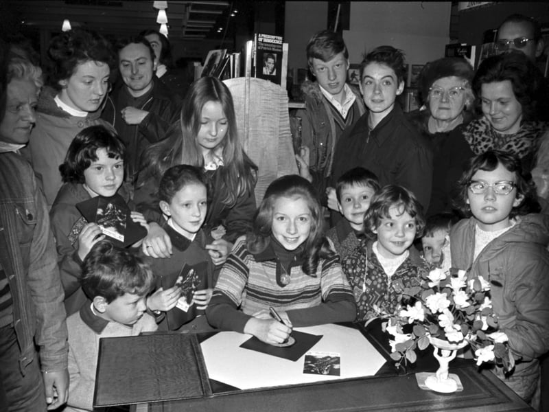 Twelve-year-old Scottish singer Lena Zavaroni signs records for fans at John Menzies in Edinburgh in April 1976