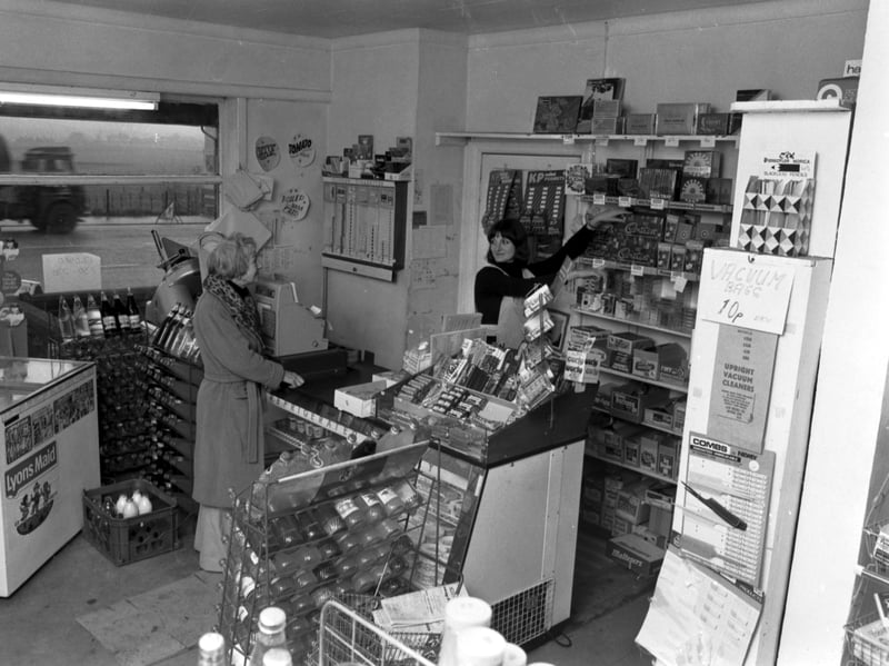 A woman shopping at Kemp's General Store, on Glasgow Road, Edinburgh, in October 1976
