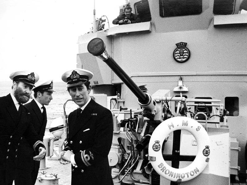 Prince Charles takes charge of the minesweeper HMS Bronington, his first command, at Rosyth dockyard, in February 1976. He is seen relieving Lieutenant Commander Harry Bates, far left, with First Lieutenant Roy Clare also pictured.