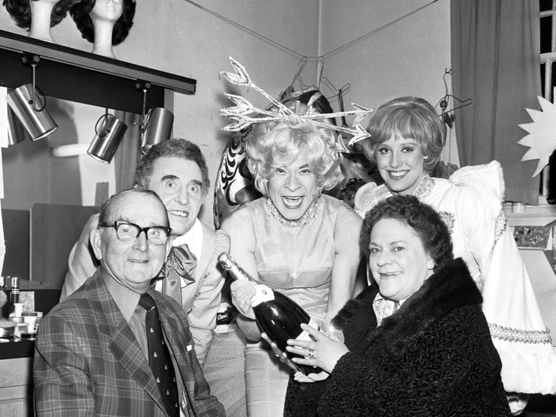 The 100,000th visitor to the Jack and the Beanstalk pantomime at the King's Theatre, Edinburgh, wins a bottle of champagne and a trip backstage to meet stars Stanley Baxter and Patricia Michael in February 1976