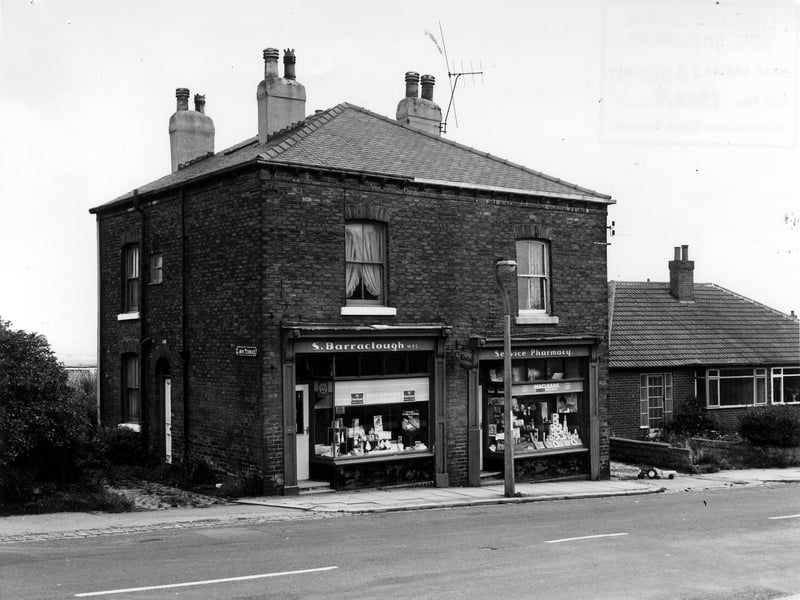  Main Street in September 1974 showing junctions with Lawns Terrace on the left and Belle Vue Terrace to the right. In between is the shop of S. Barraclough, chemist, which occupies both no. 2 Lawns Terrace and no. 1 Belle Vue Terrace. The bungalows on the right are nos. 10 and 9 The Close.