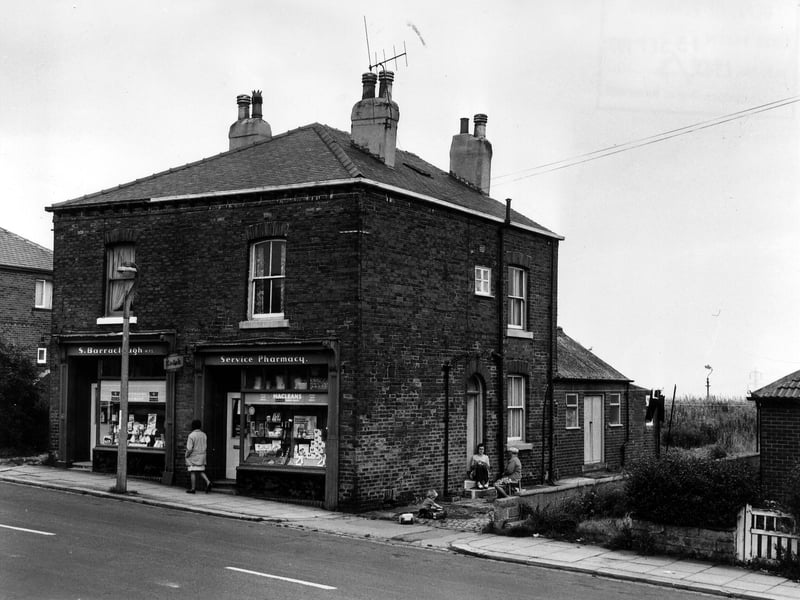  Main Street in September 1974 showing the junctions with Belle Vue Terrace in the centre and Lawns Terrace on the left. In between is the shop of S. Barraclough, chemist, which occupies both no. 1 Belle Vue Terrace and no. 2 Lawns Terrace. On the right, a bungalow at no. 10 The Close is just visible. 