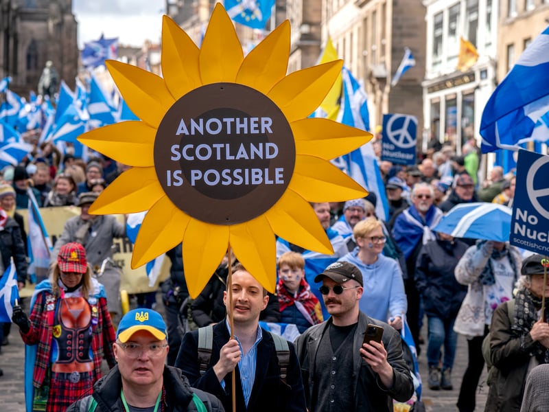 A sunflower banner among the Saltires spelled out the message "Another Scotland is possible"